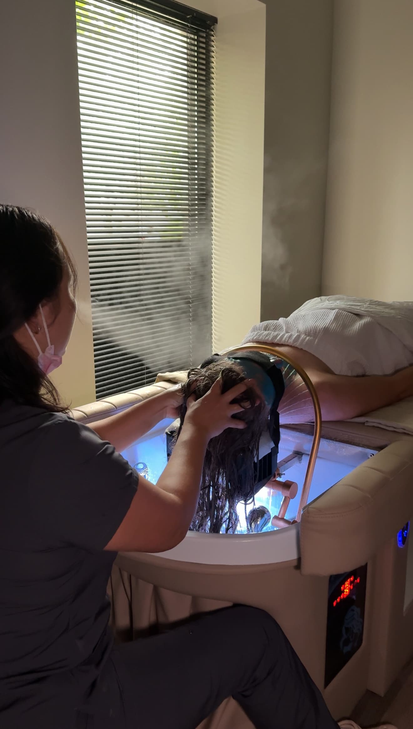 Specialist performing a Japanese Head Spa scalp treatment at 4Hands in Charlotte
