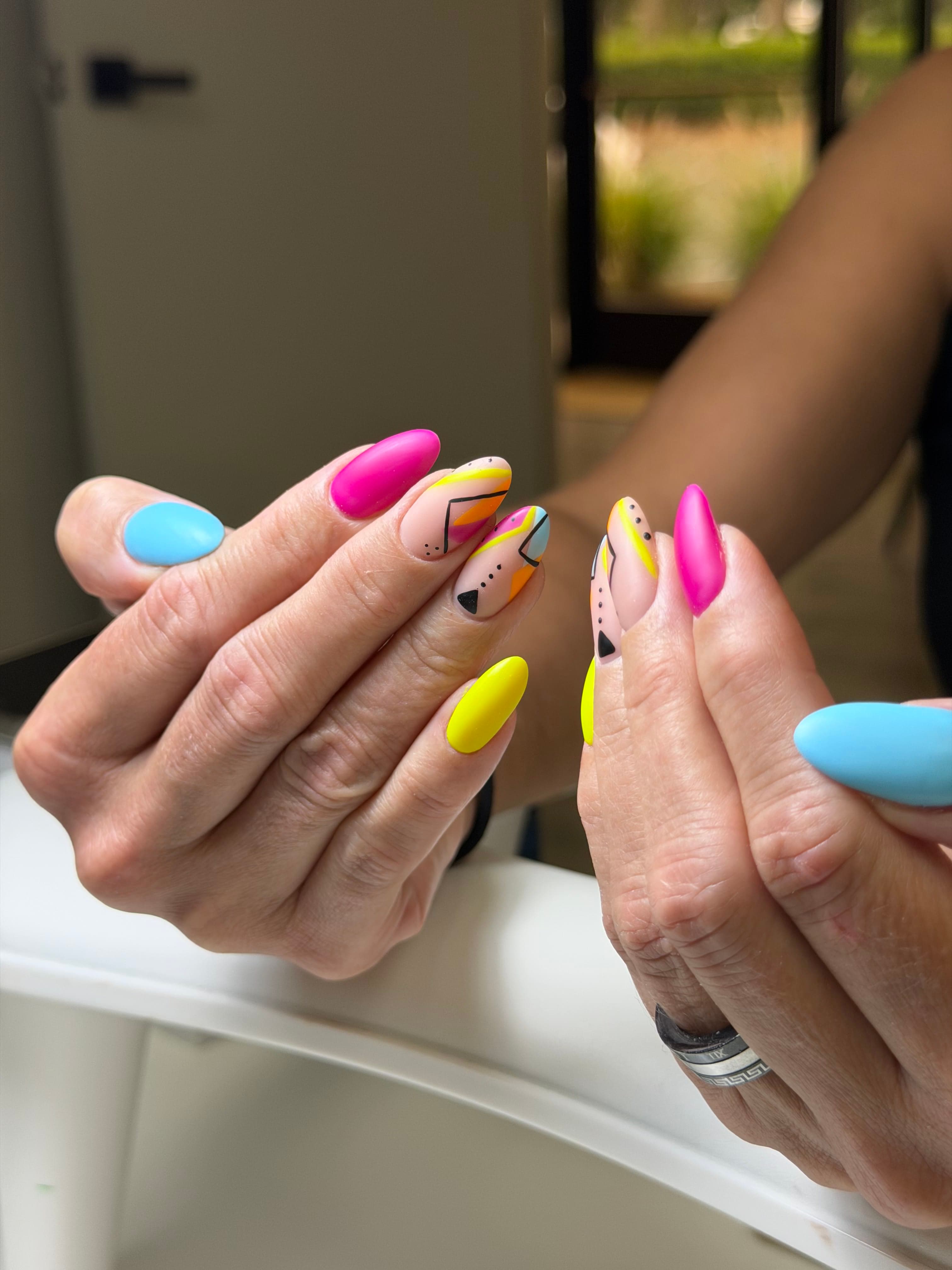 Colorful custom nail art with abstract design at 4Hands in Charlotte